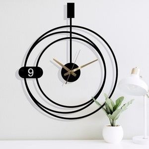 ساعت دیواری فلزی مدرن کد H/133 رنگ طلایی/ نقره ای